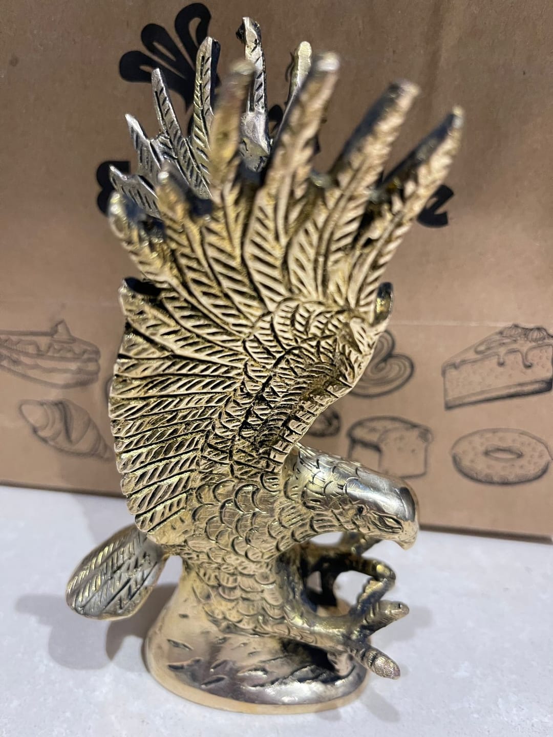 Customer photo review of Brass Eagle Idol Vastu Remedy for Vision, Authority and Success Energy for Home and Office | 5 x 8 x 15 cm | 650 gm