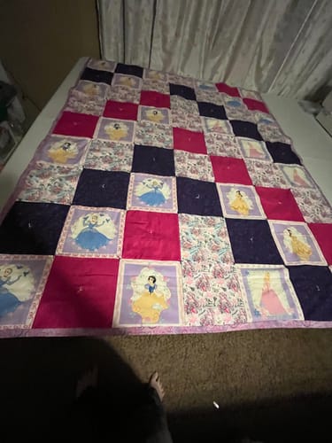 Customer's finished patchwork quilt made with the purple Princess Follow Your Dreams Fabric.