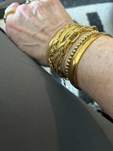 Reviewer shows the Meadow Bracelet Bundle worn stacked on their wrist.