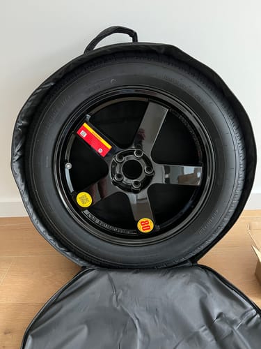 Customer's Jaecoo J5 Space Saver Spare Wheel in its open black carrying bag.