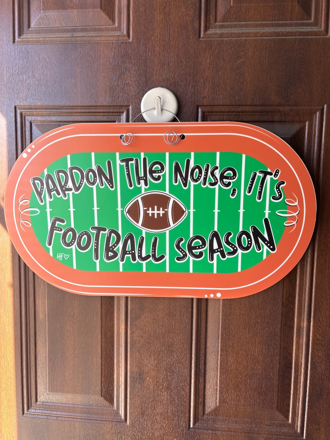 Customer photo review of Pardon the Noise, It's Football Season Door Hanger