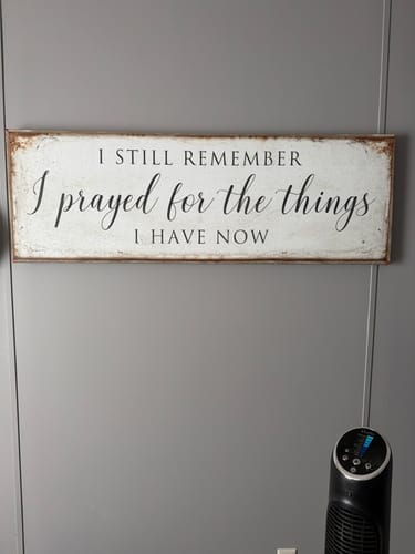 Customer's rustic Faith Sign on a gray wall, reading 'I still remember I prayed for the things I have now'.