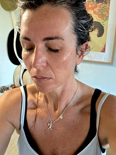 Customer's face with hydrated, glowing skin in a review for the biolumin-c serum.