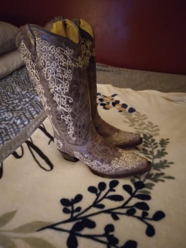 Customer's brown Crater Bone Embroidery Boots, showing the intricate white embroidery on the shaft and foot.
