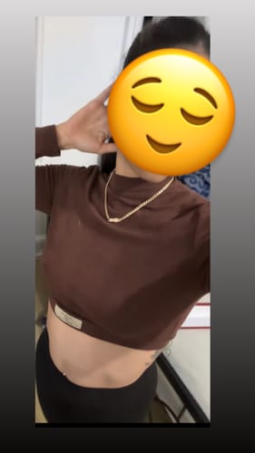Reviewer wearing the 14K Hollow Cuban Choker with a brown long-sleeve crop top.