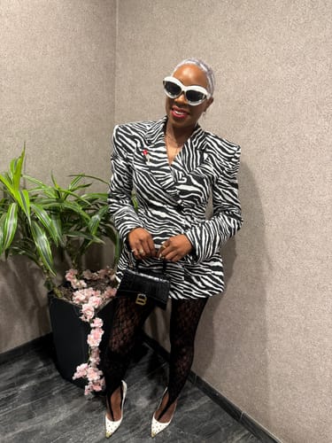 Customer wearing the bold Suiting Zebra Jacquard Blazer, showing its structured shoulders and fitted waist.