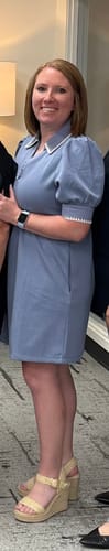 Reviewer wearing the blue Contrast Edge Shift Dress, showing the white trim on the collar and puffed sleeves.
