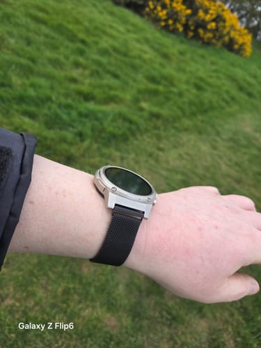 Customer's Gard Pro Ultra 3 watch with a silver case and dark mesh band, shown on a wrist outdoors.