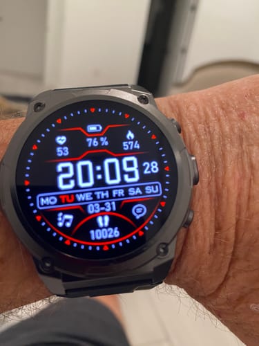 Customer showing the Gard Pro Ultra 3 on their wrist. The digital display is lit, showing health and time data.