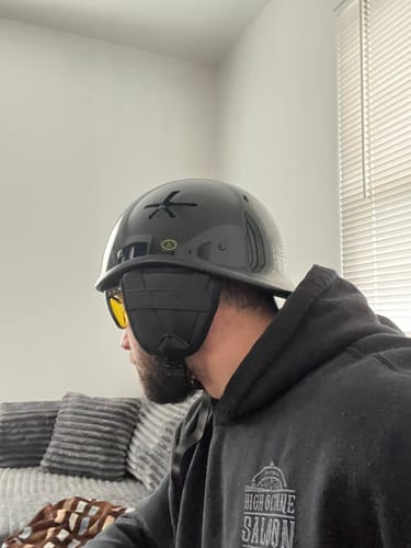 Customer wearing the gloss black Switchback DOT Reversible Helmet, showing off its low-profile fit from the side.