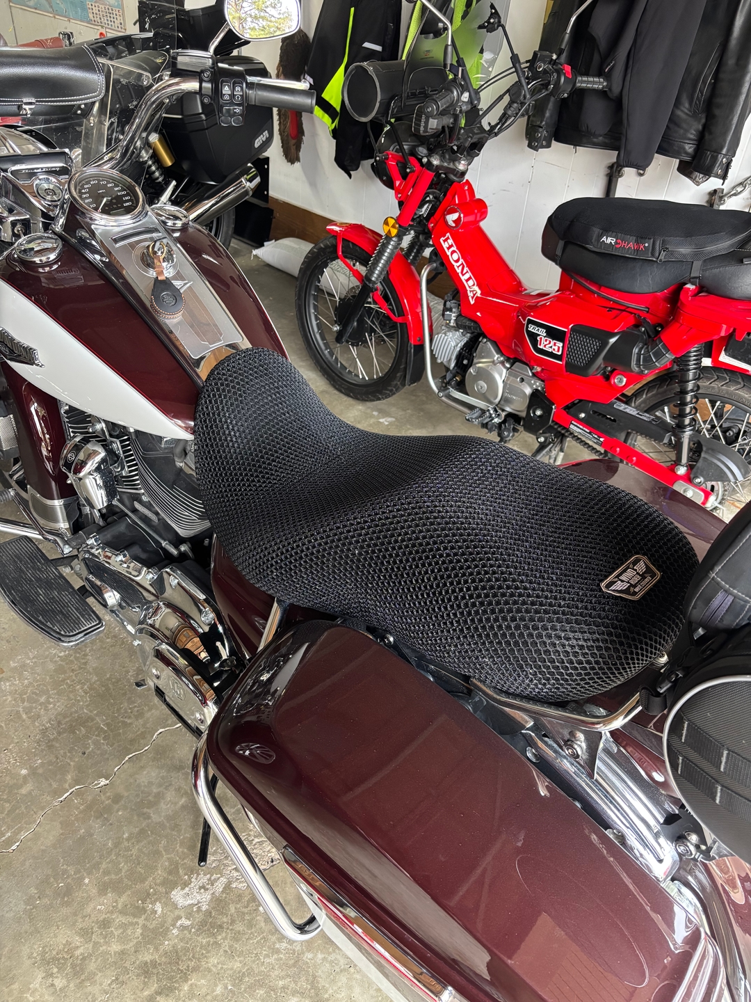 Wind Rider 3D mesh seat cover fitted over the seat of a Harley bagger, full bike visible in daylight