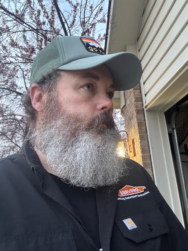 Customer showing the comfortable fit of the green Big Foam Trucker Hat.