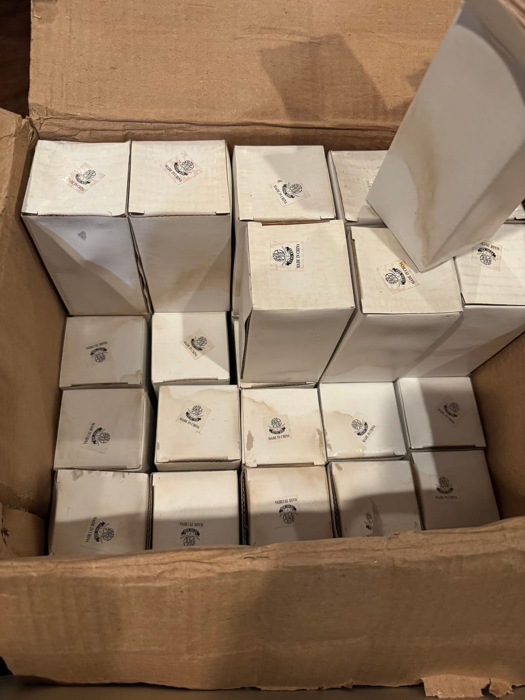 Customer photo review of Elegant Decorative Handheld Glass Bell Item is Brand New Box has minor dent & yellowing due to storage