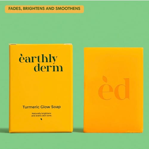 Reviewer's Turmeric Fade & Glow Bar, a solid yellow soap, shown next to its packaging.