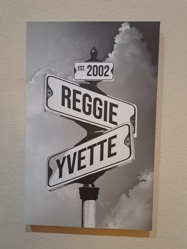Customer's personalized canvas showing intersecting street signs with the names 'Reggie' and 'Yvette' and the date 'Est. 2002'.