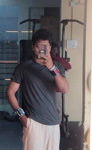 Reviewer wearing the Thunderstrike Wrist Wraps on both wrists in a gym.