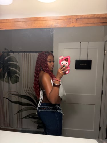 Reviewer taking a mirror selfie from the side in a bathroom; the product is not visible.