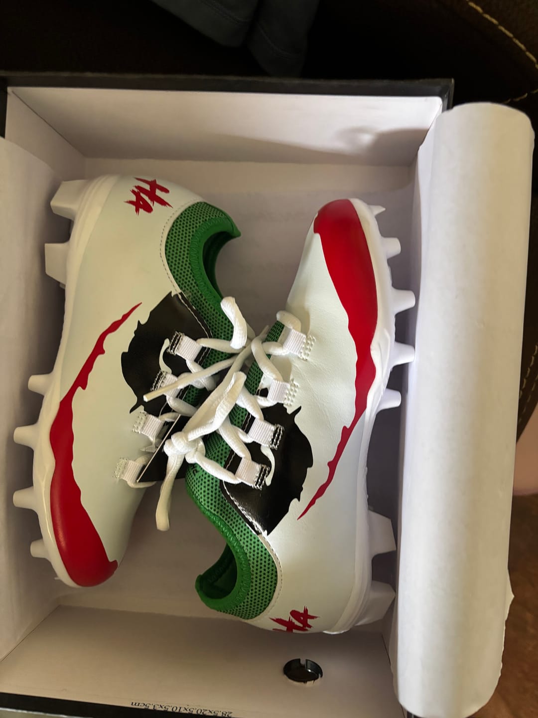 Customer photo review of The Officially Licensed Joker Youth Football Cleats - Velocity 2.0 by Phenom Elite