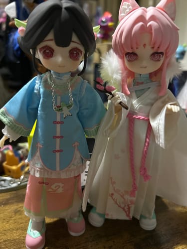Customer's two Nagi Windrider figures side-by-side. One has black hair in a blue outfit; the other has pink hair and cat ears.