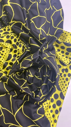 Customer's close-up of the yellow printed maxi dress, showing the fabric and pocket detail.