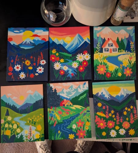 Customer showing six completed colorful landscape mini paintings from the set, arranged in two rows.