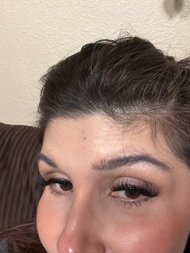 A close-up of a reviewer's eyes, showcasing the dramatic and voluminous Manga lashes.