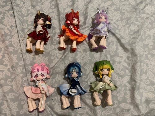 Customer's complete set of 6 colorful Antu Bestiary of All Spirits action figures displayed on a bed.