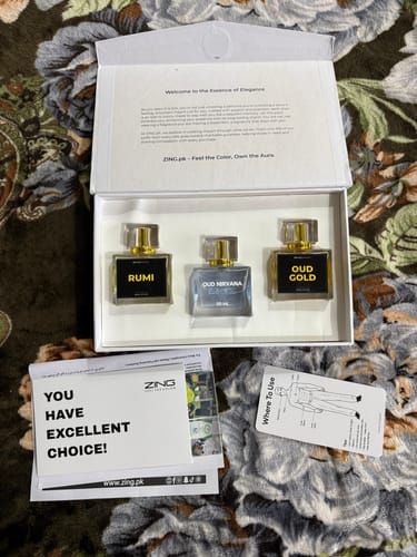Customer's Khushboo-e-Ramzan bundle in its white presentation box, showing the Rumi, Oud Nirvana, and Oud Gold bottles.