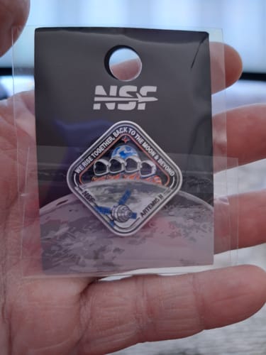 Customer holding the Artemis II - Collectors Patch in its clear original packaging.