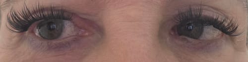 Customer's eyes with long, dark Catseye false eyelashes applied.
