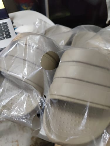 Customer's adidas Adilette Flow Slides still in their original plastic packaging.