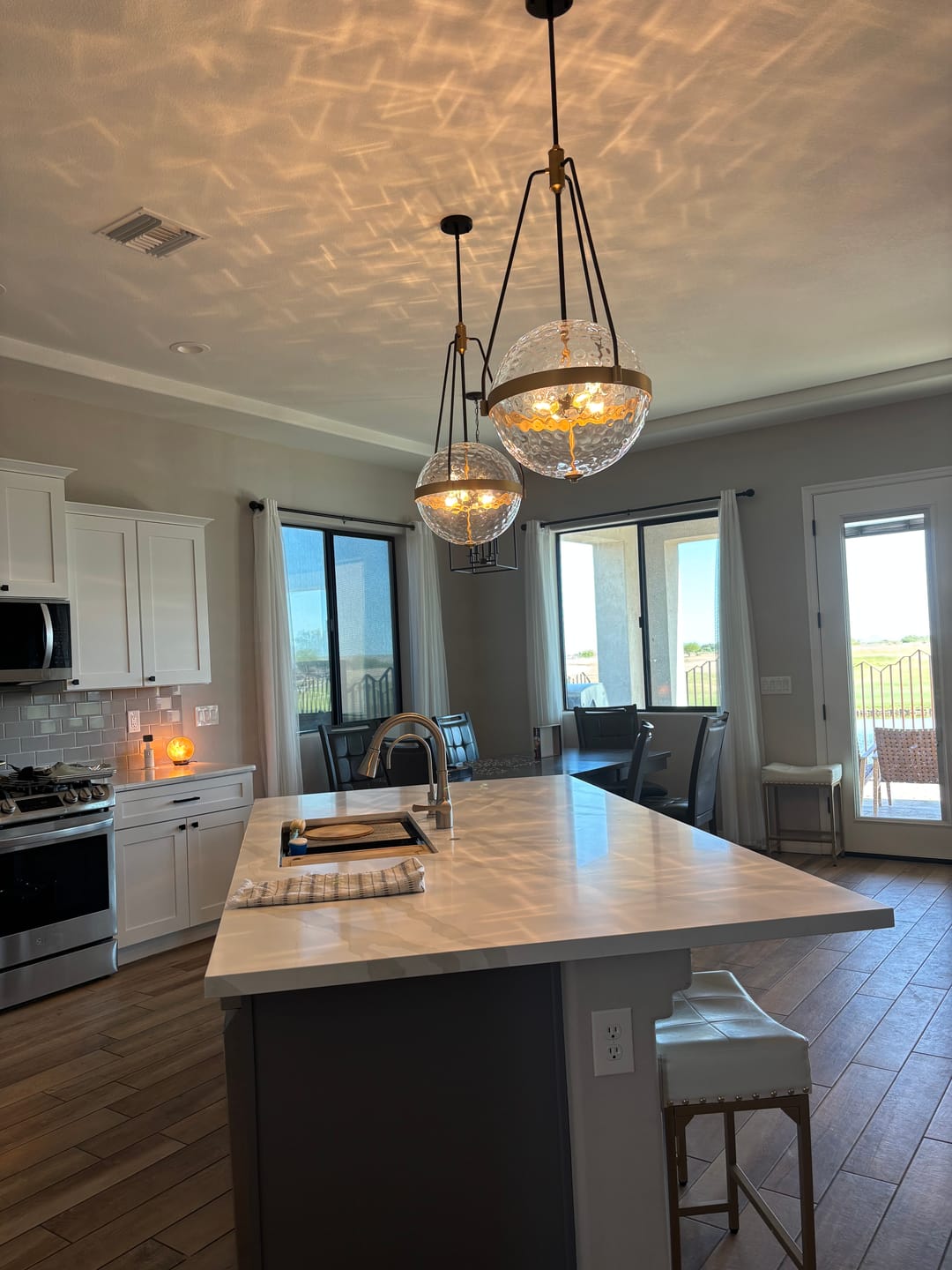 Customer photo review of 4-Light Water Hammered Glass Sphere Pendant