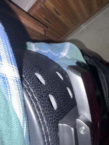 Close-up of the reviewer's black Wings of Glory Lever Belt, showing the metal lever and the last two adjustment holes.