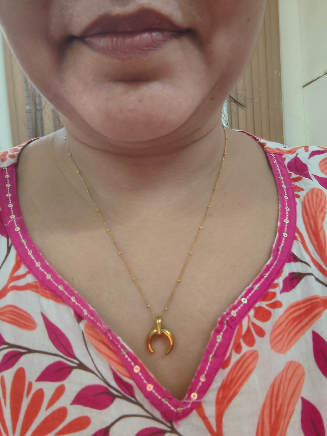 Customer photo review of Tiny Horn Necklace