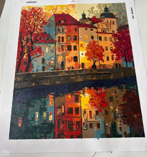 Customer's completed Prague Paint by Number painting showing colorful buildings with autumn trees reflected in water.