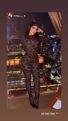Customer showing the bodycon fit of the bold Naked Print Tights and matching top.