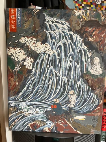 Customer's completed Somen Waterfall paint by numbers canvas, showing the detailed blue and white cascading waterfall and figures.