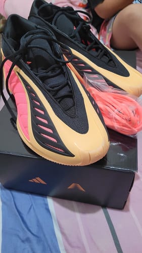Customer's new adidas Anthony Edwards 2 Basketball Shoes in a peach, pink, and black colorway, shown on top of the shoebox.