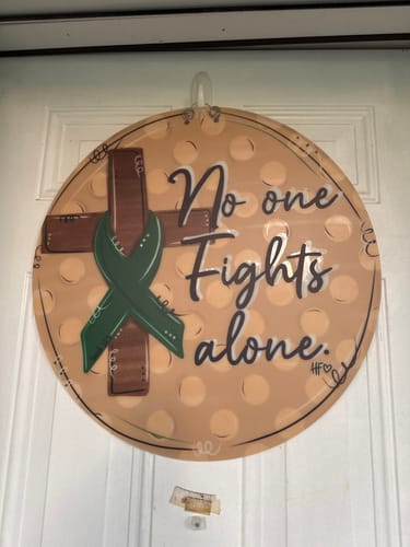 Customer photo review of No One Fights Alone Green Ribbon Cross Door Hanger