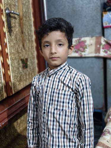 Reviewer's photo of a young person in a plaid shirt, submitted with a review for OUD Supreme BUNDLE.