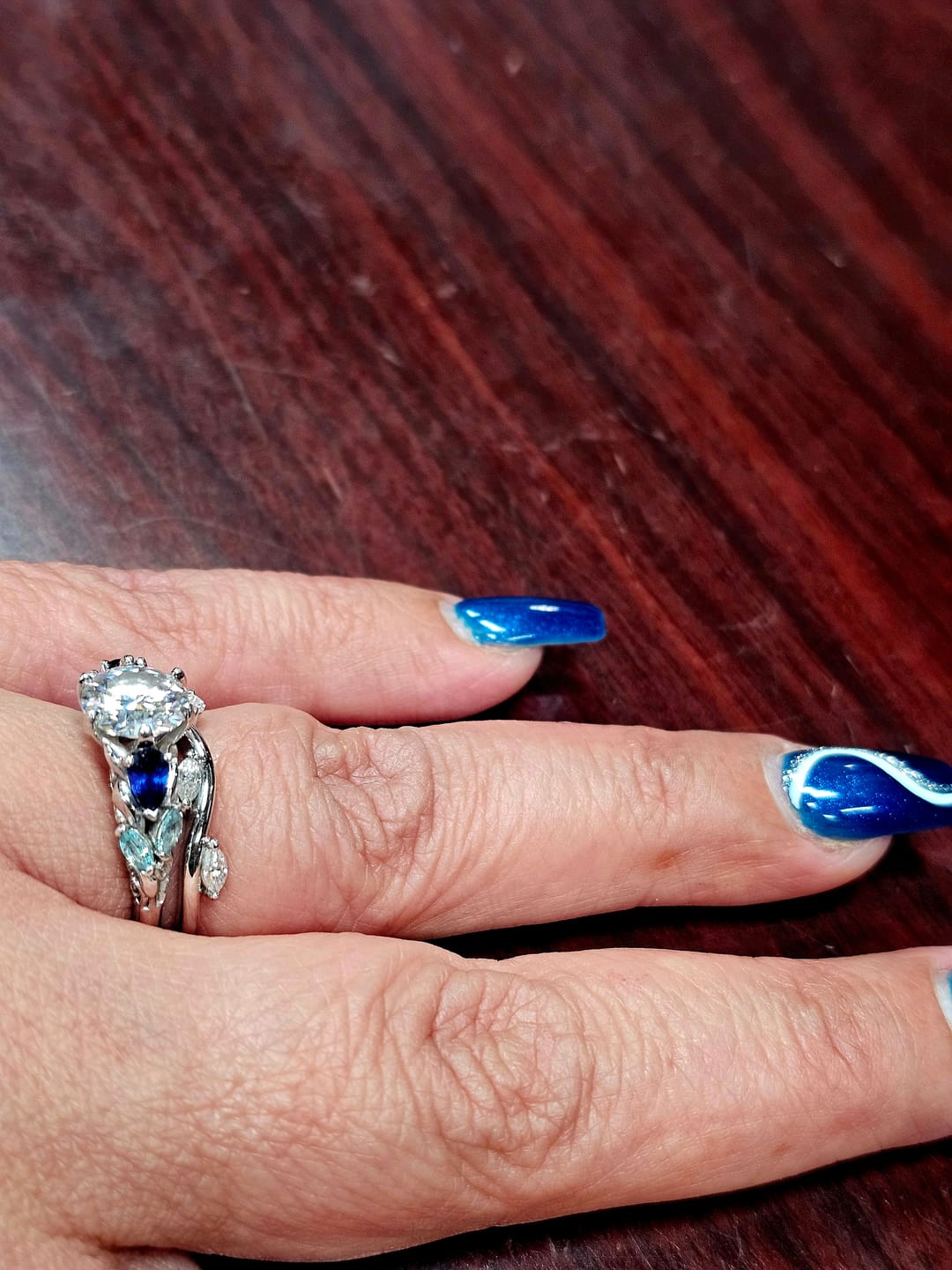 Customer photo review of Moissanite And Cluster Sapphire Filigree Vine Engagement Ring