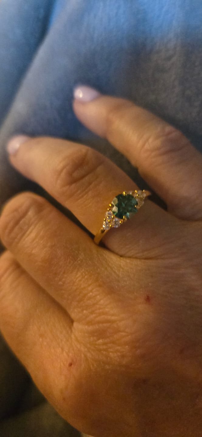 Customer photo review of Green Moissanite Side Stone Engagement Ring