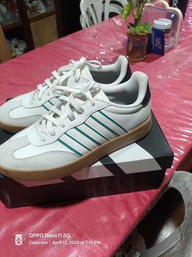 Customer's white adidas Barreda Casual Shoes with green stripes and a gum sole, resting on the shoebox.