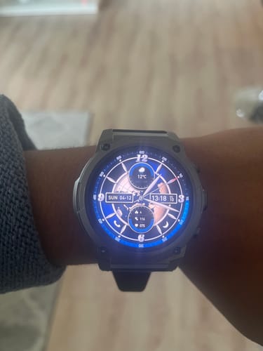 Reviewer shows the Gard Pro Ultra 3 fitted on their wrist, with its detailed digital face illuminated.