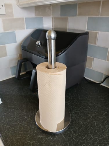 Customer's naked unbleached bamboo kitchen roll on a holder on a kitchen counter.
