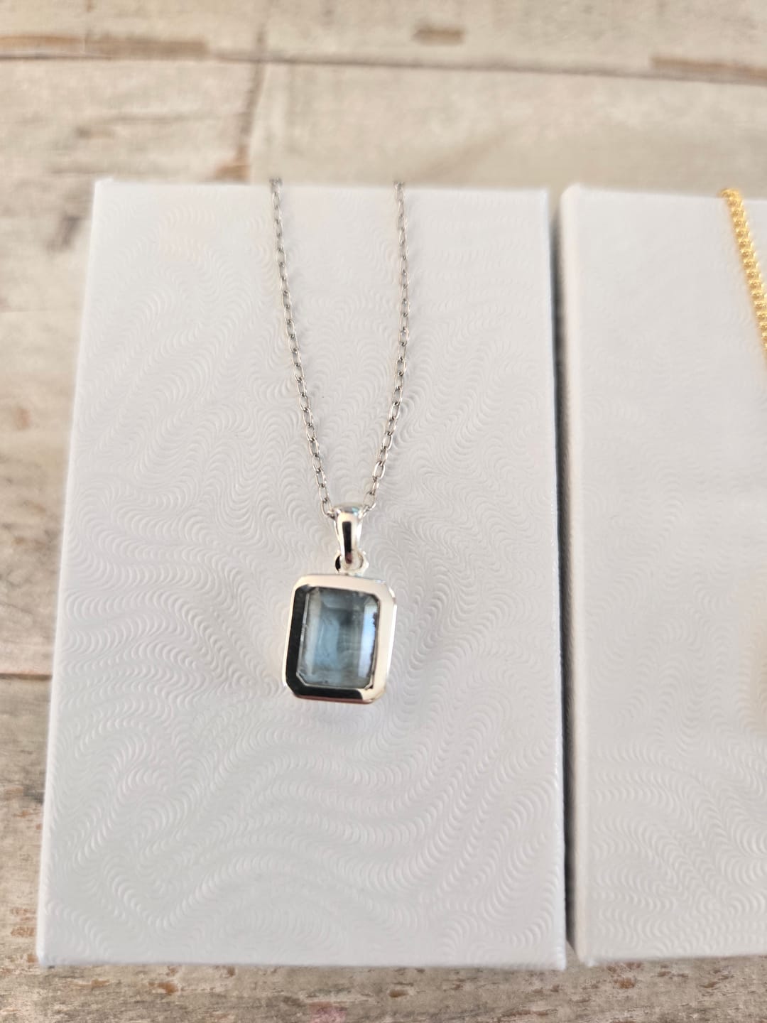 Customer photo review of Dainty Blue Topaz Square Pendant
