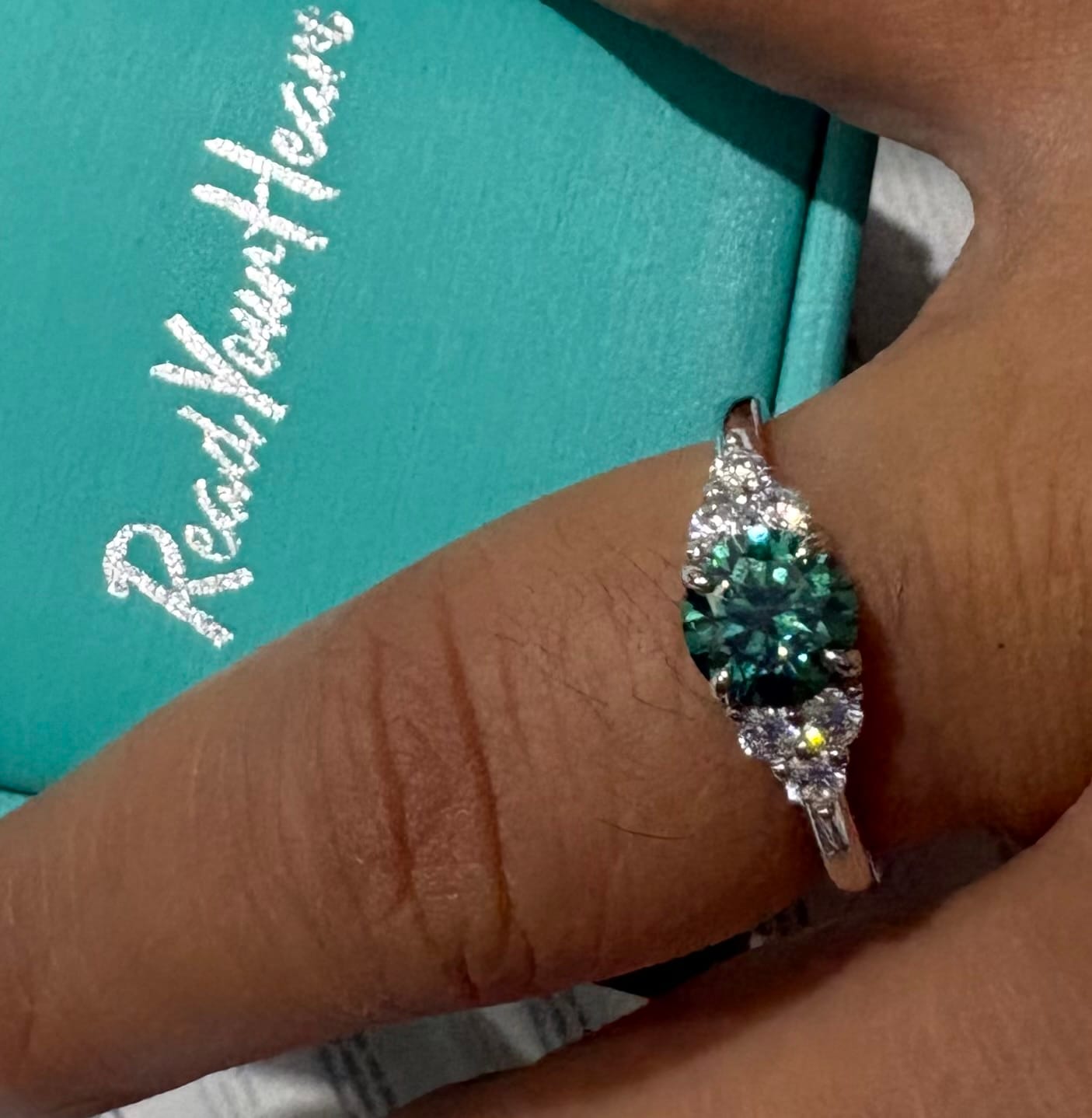 Customer photo review of Green Moissanite Side Stone Engagement Ring