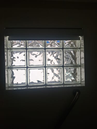 Customer photo review of SmartWings Motorized Roller Shades 100% Blackout Linen