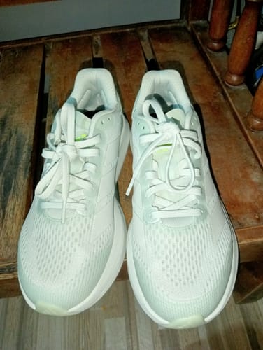 Customer's white adidas Duramo Speed 2 Running Shoes shown from above on a wooden surface.