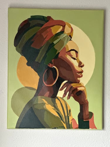 Customer's finished Golden profile Paint by Number artwork, showing a woman in a colorful headwrap against a green background.